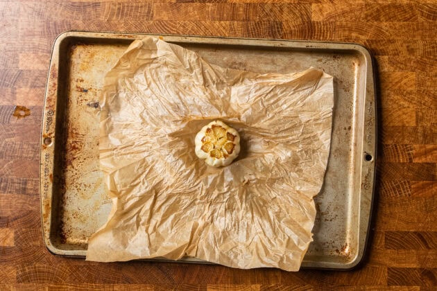 roasted garlic on a parchment lined baking tray.