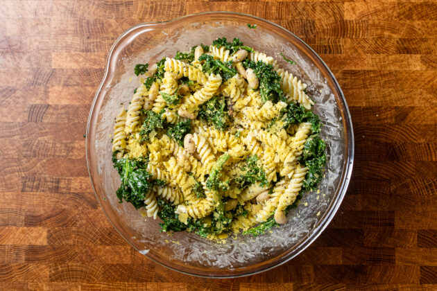 caesar pasta salad with kale in a bowl