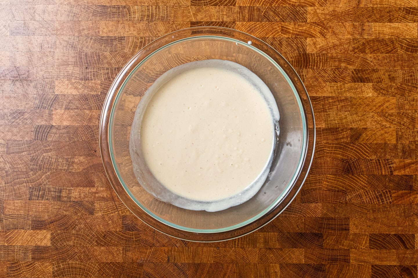 wet ingredients mixed together in a glass bowl.