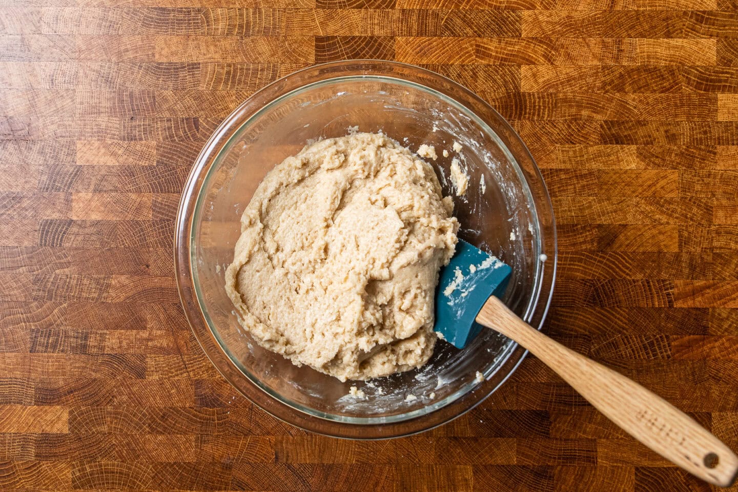 vegan pound cake ingredients mixed together in a glass bowl.