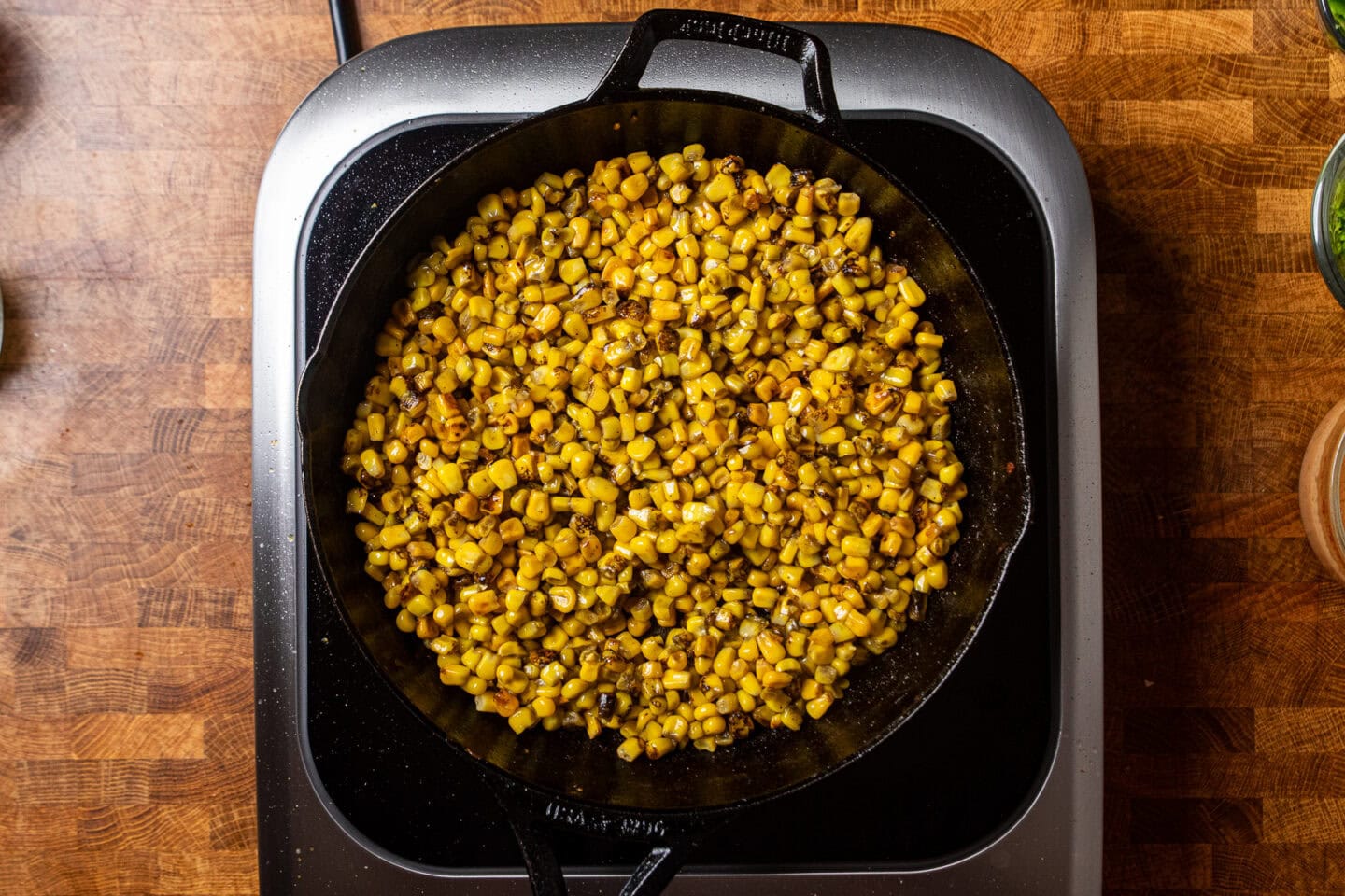 corn charring in a cast iron skillet.