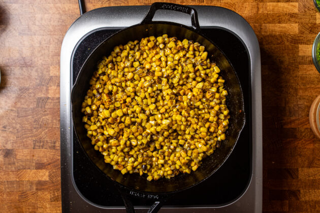 corn charring in a cast iron skillet.