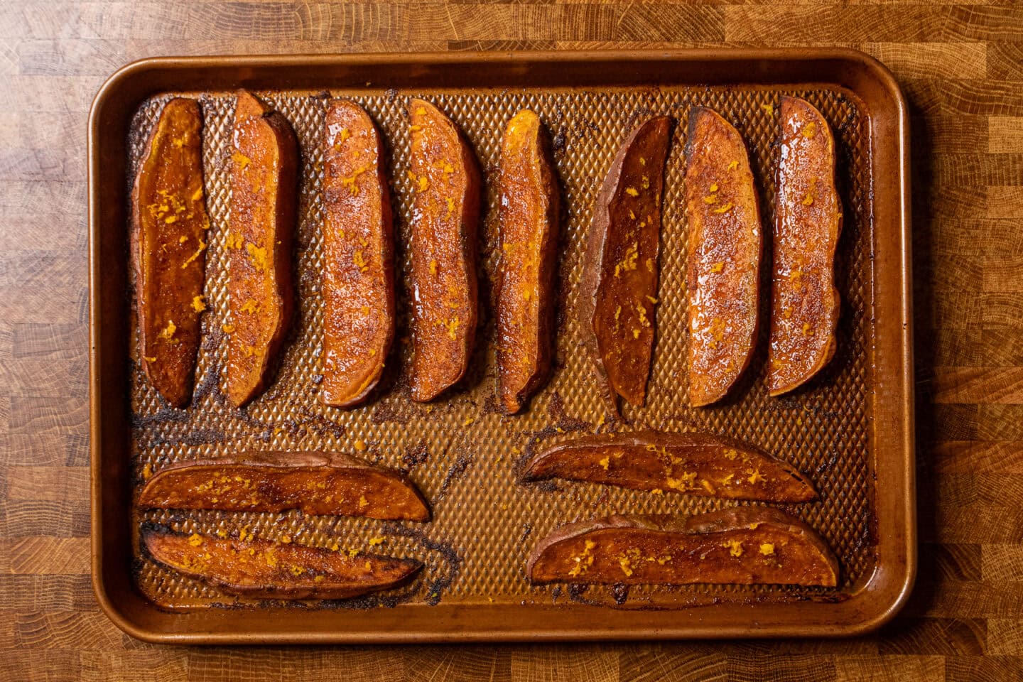roasted sweet potato wedges on a baking sheet.