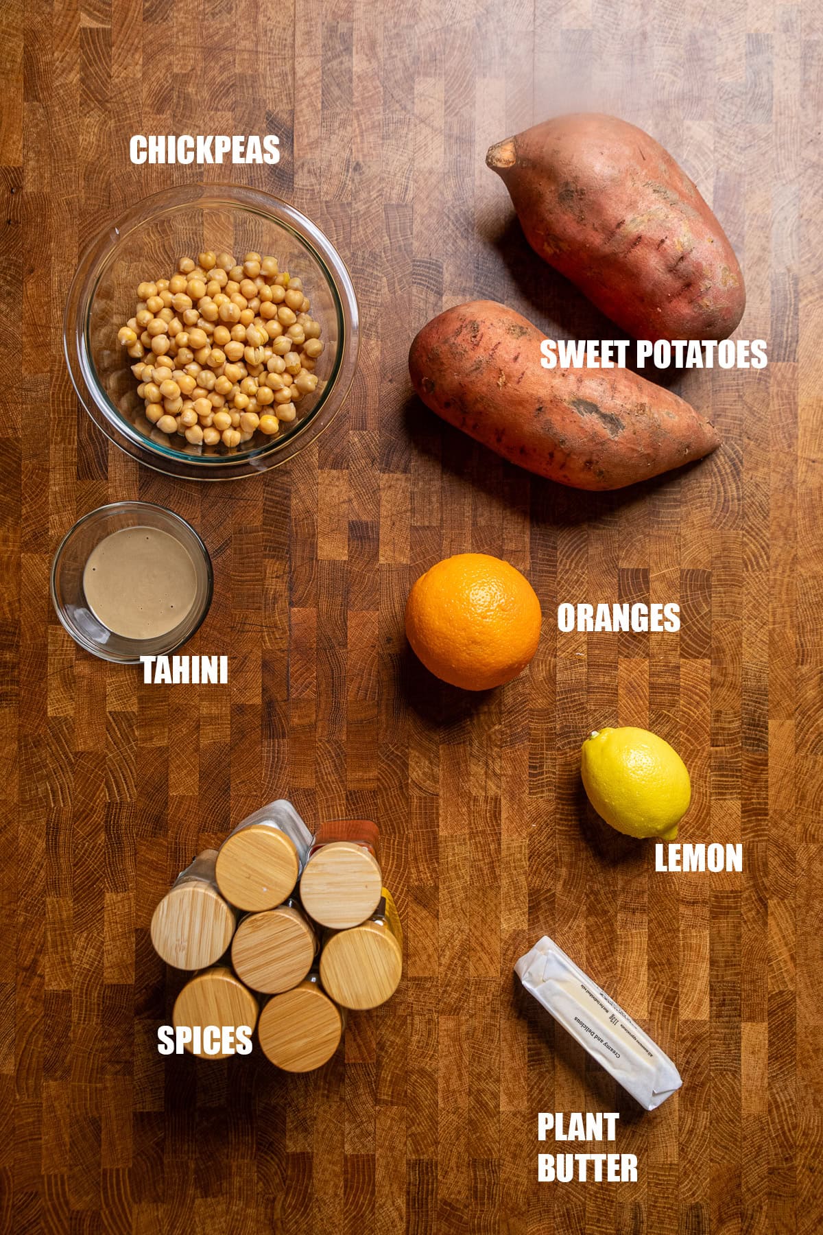 ingredients on a table to make roasted sweet potatoes and tahini butter chickpeas.