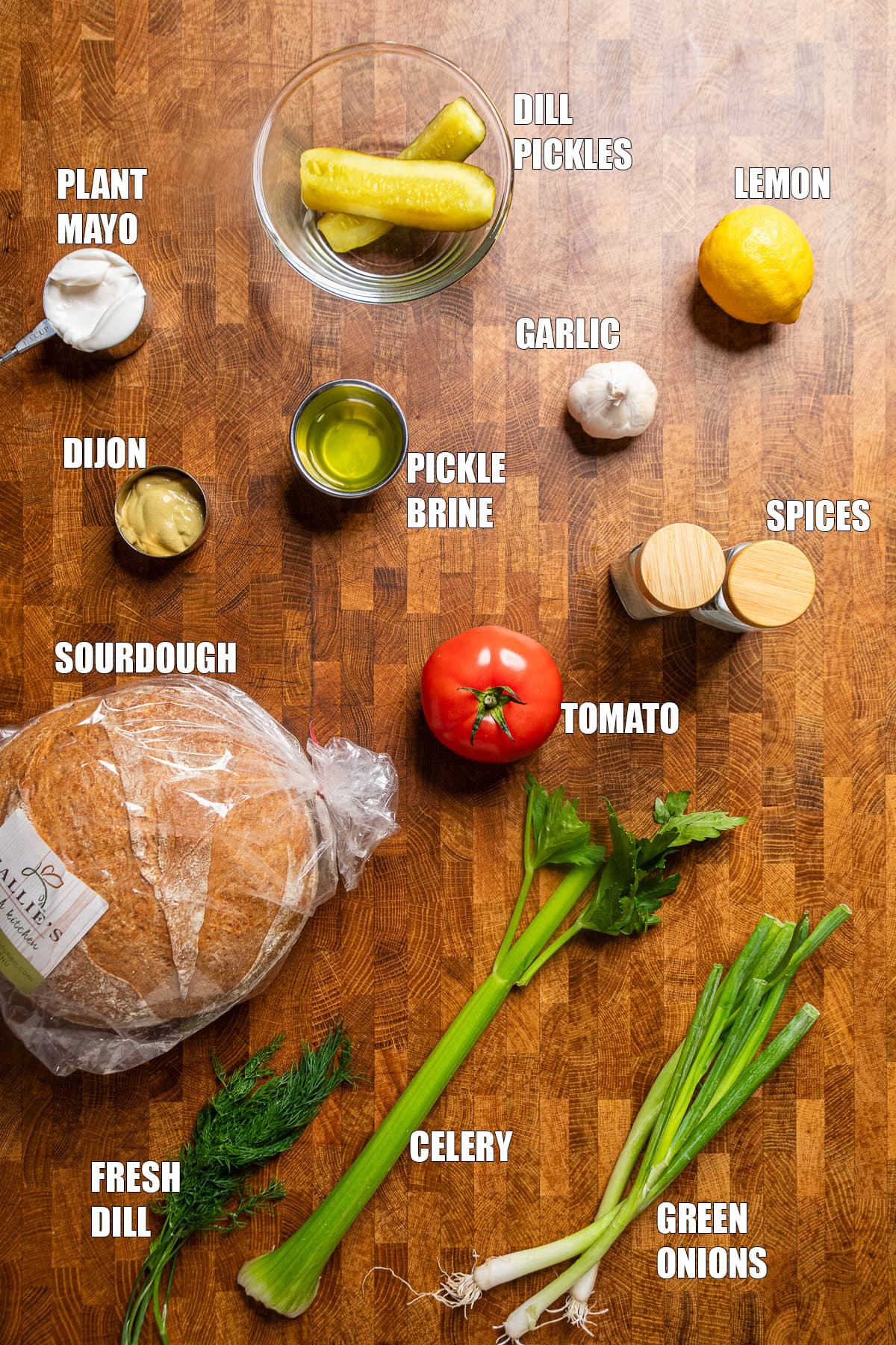 ingredients on a table to make crispy lemon dill pickle chickpea salad sandwiches.