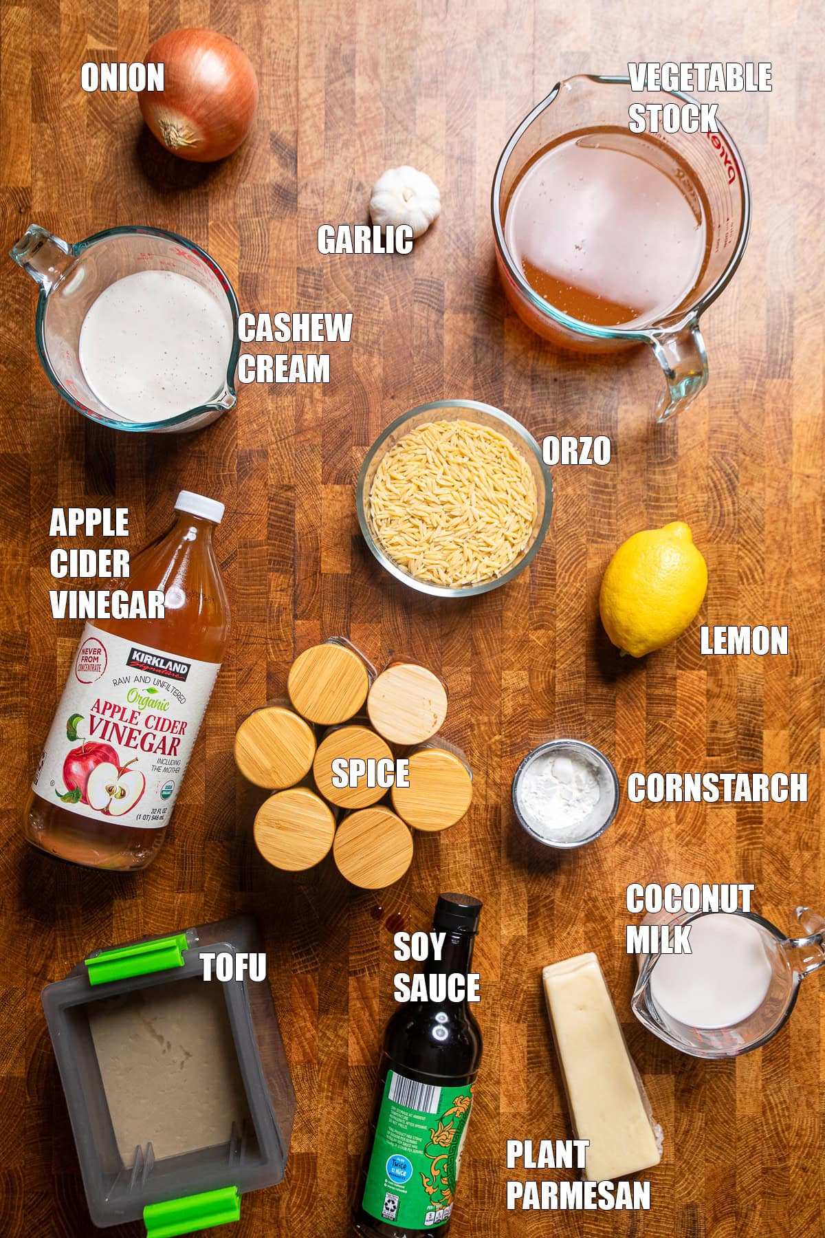 ingredients on a table to make vegan chicken alfredo orzo.