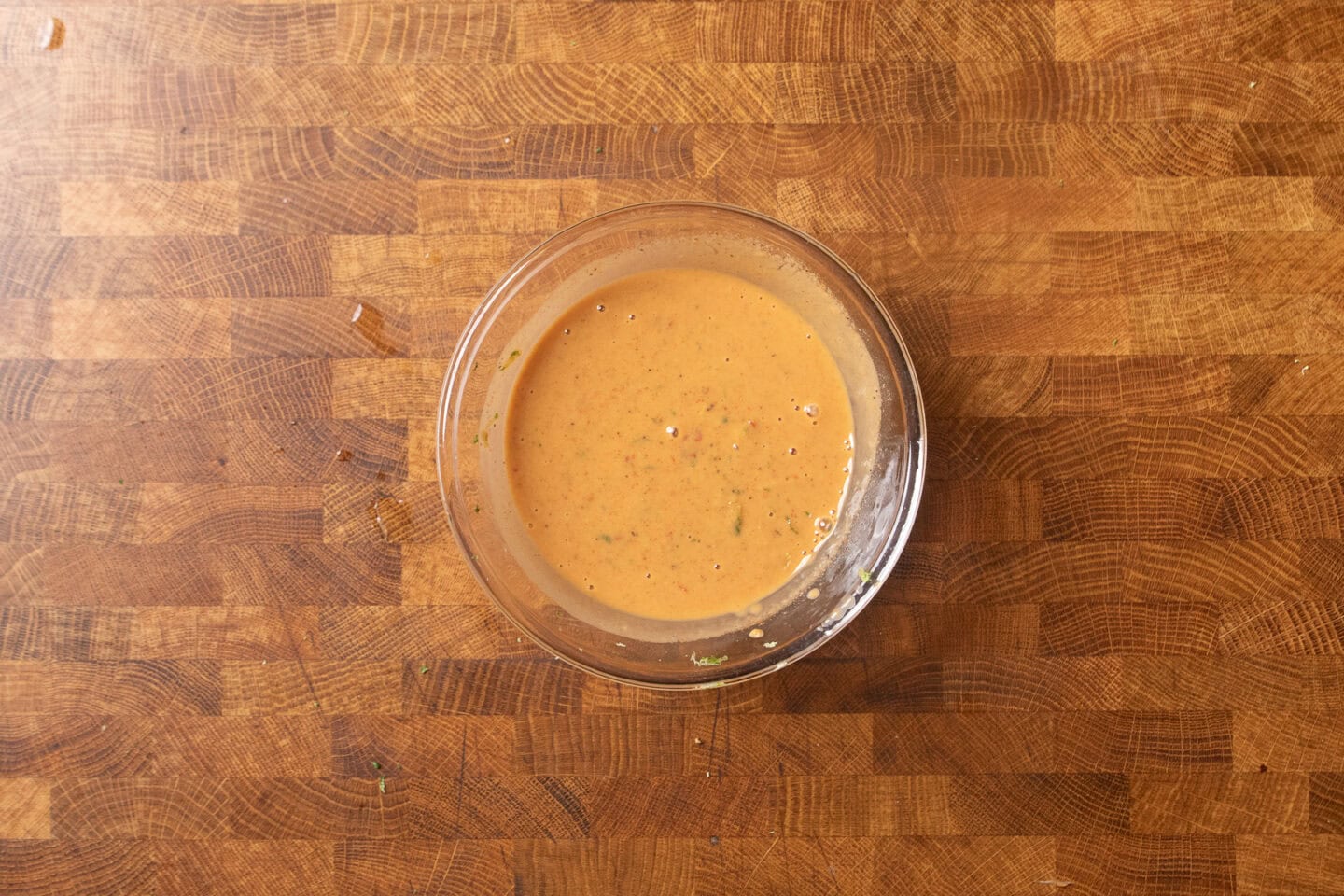 chili lime tahini sauce in a glass jar.