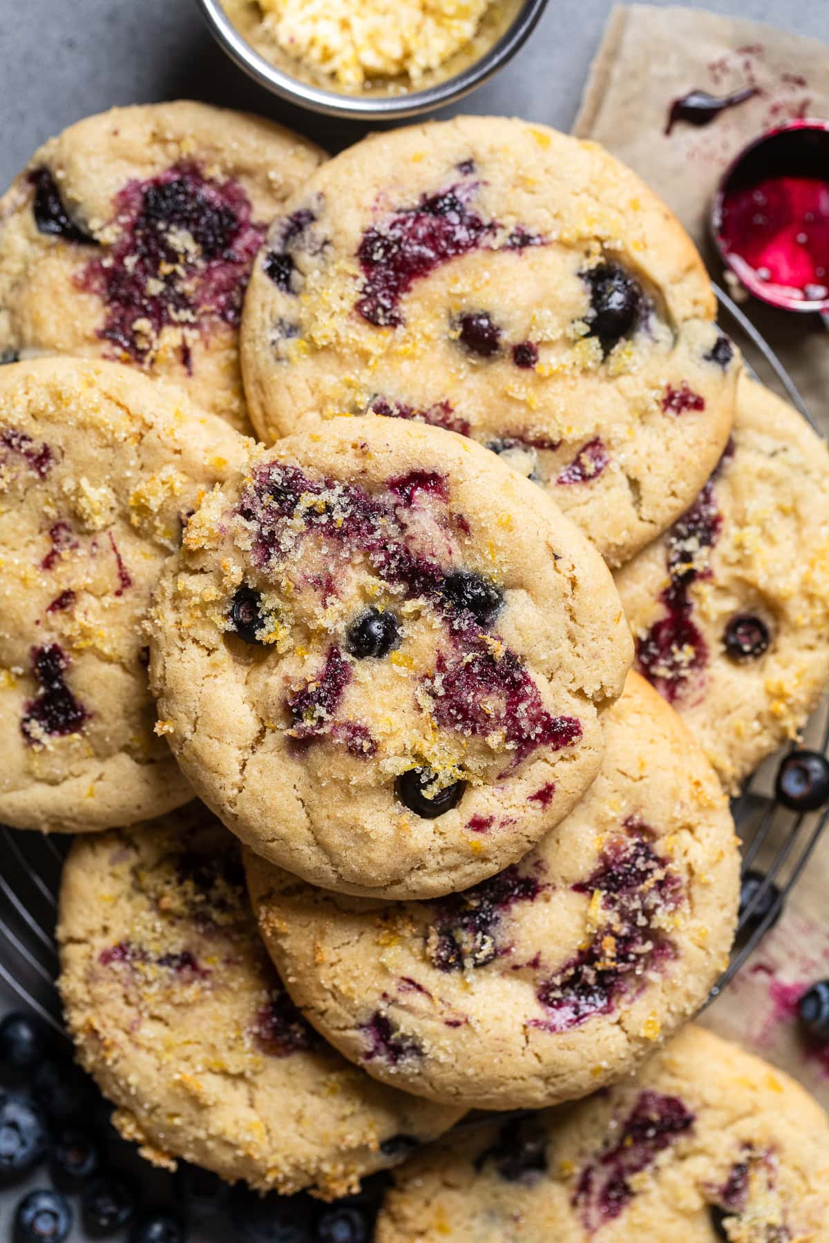 vegan lemon blueberry cookies stacked in a pile.