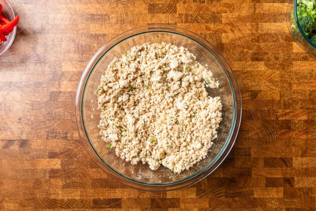 crumbled tofu mixture in a glass bowl on a table.