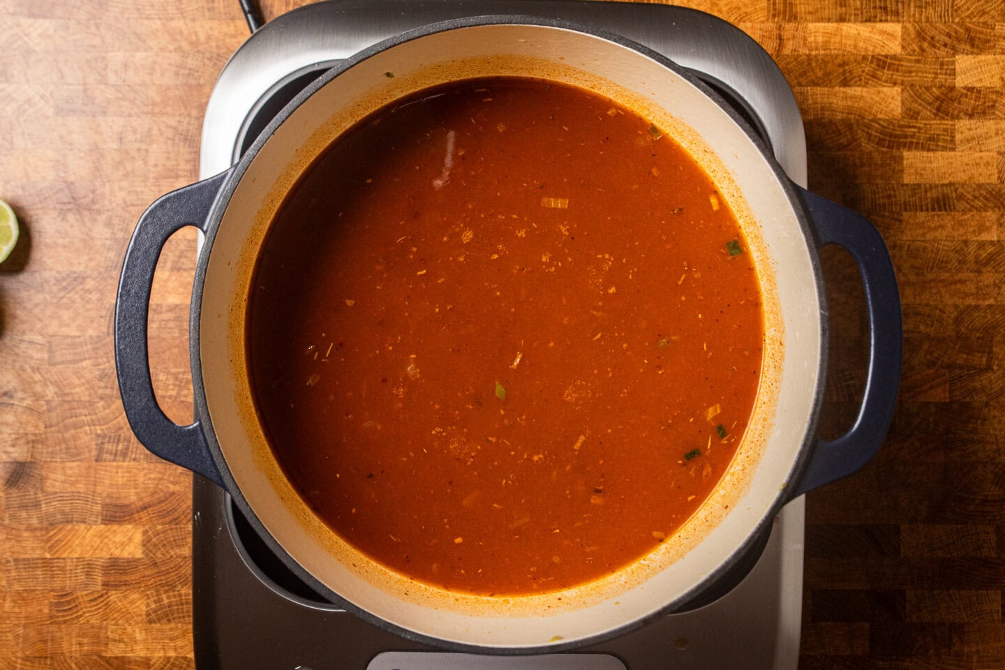 enchilada soup cooking in a pot.