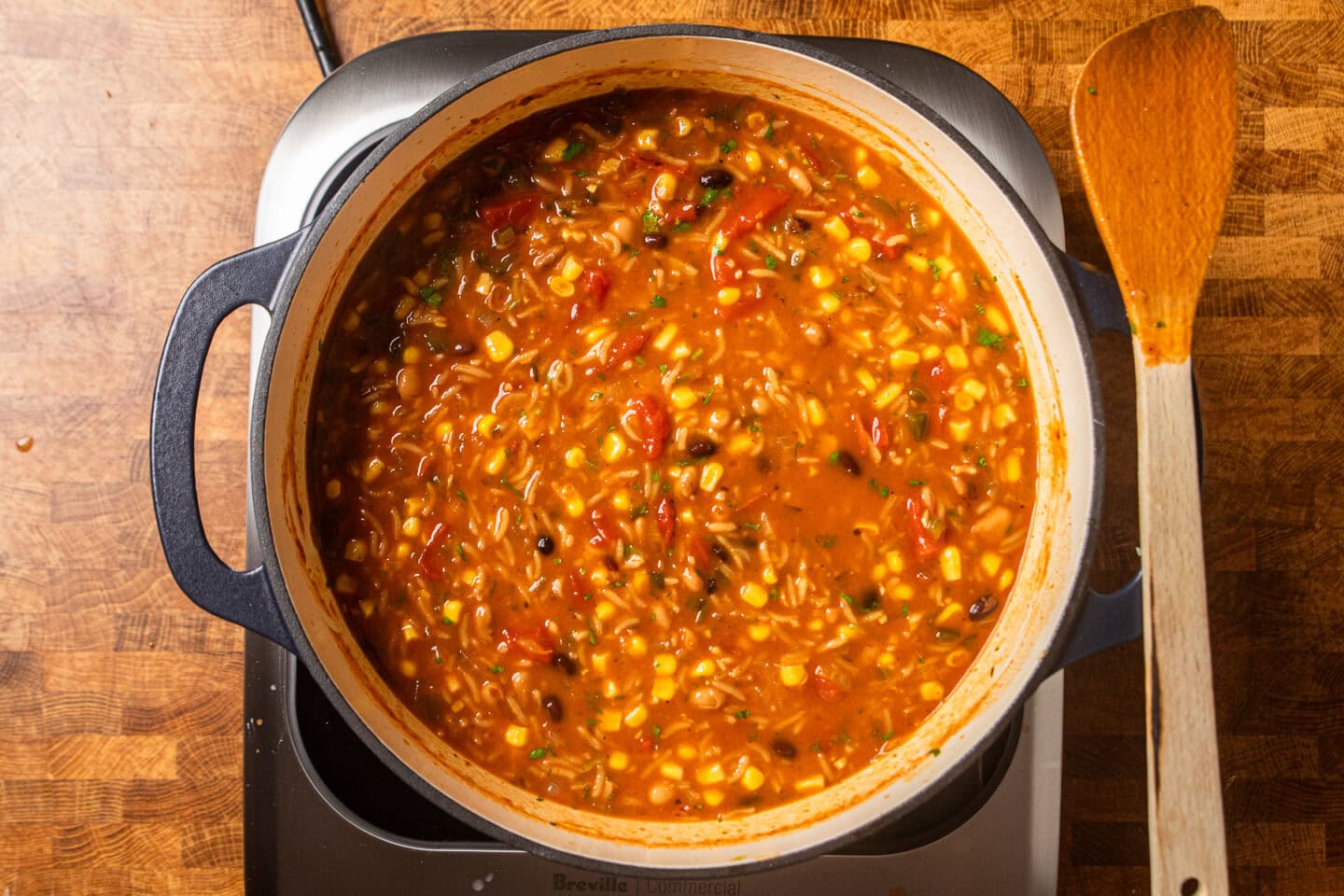 enchilada soup in a dutch oven that has thicken and ready to serve.