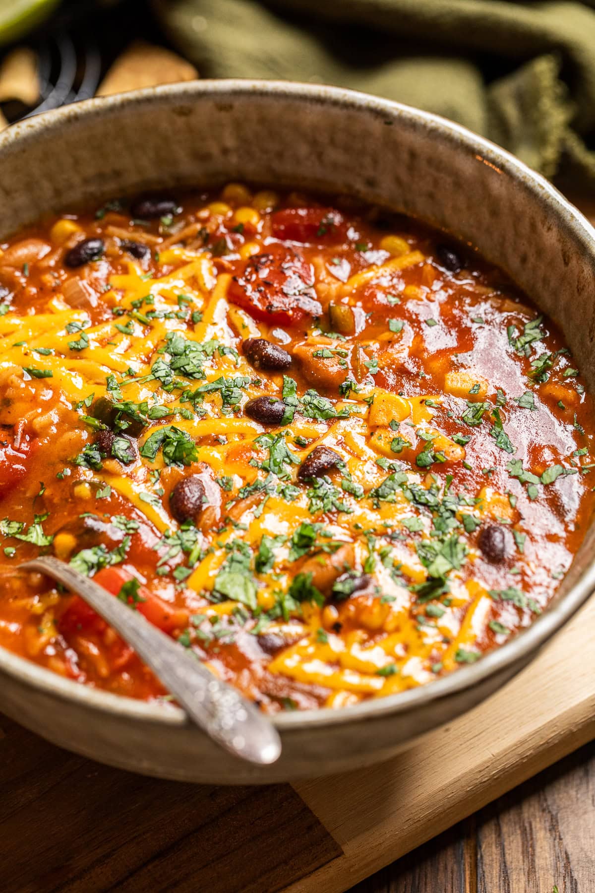 close up of a bowl of black bean enchilada rice soup.