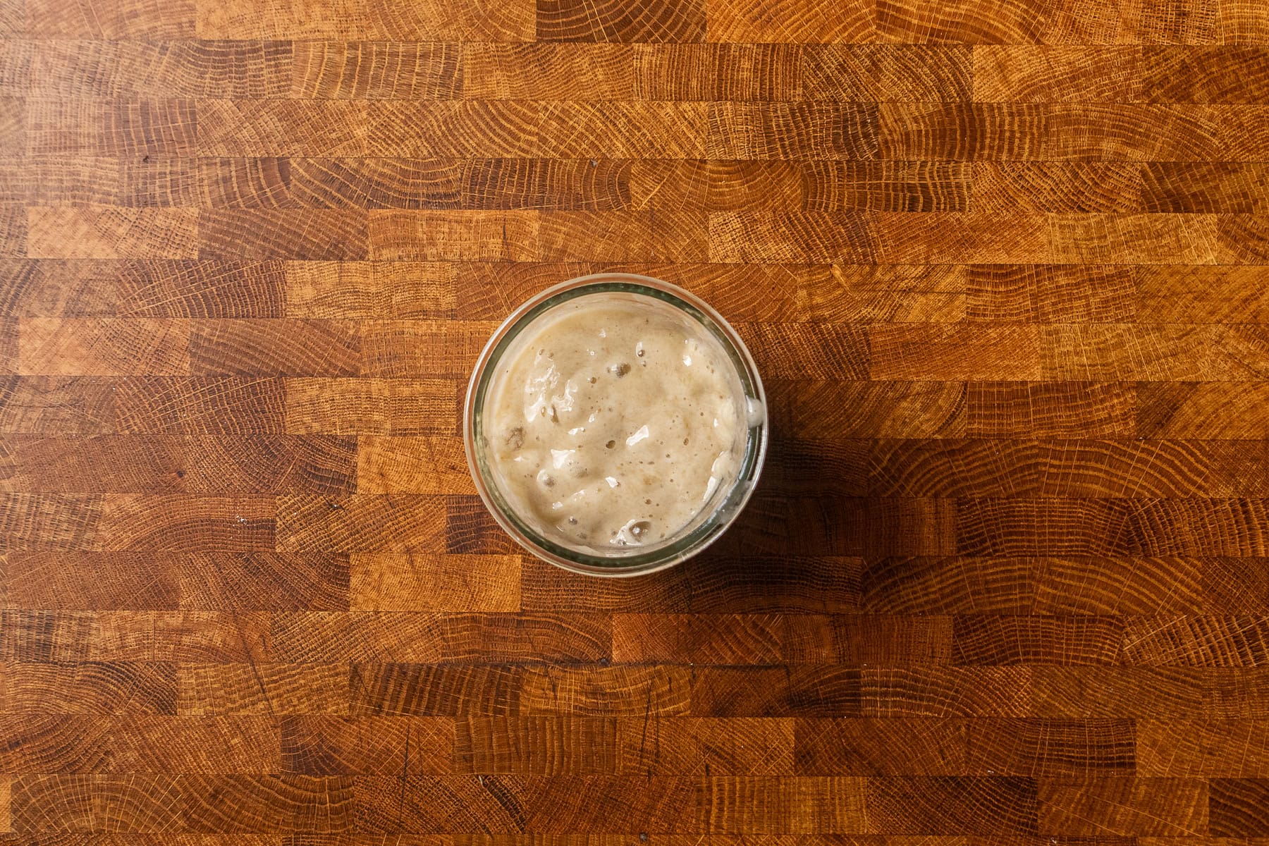 wet ingredients for baked oatmeal together in a glass dish.