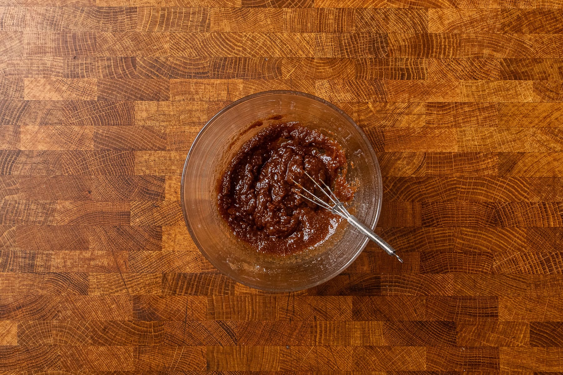 cinnamon paste mixture whisked together in a small glass bowl.