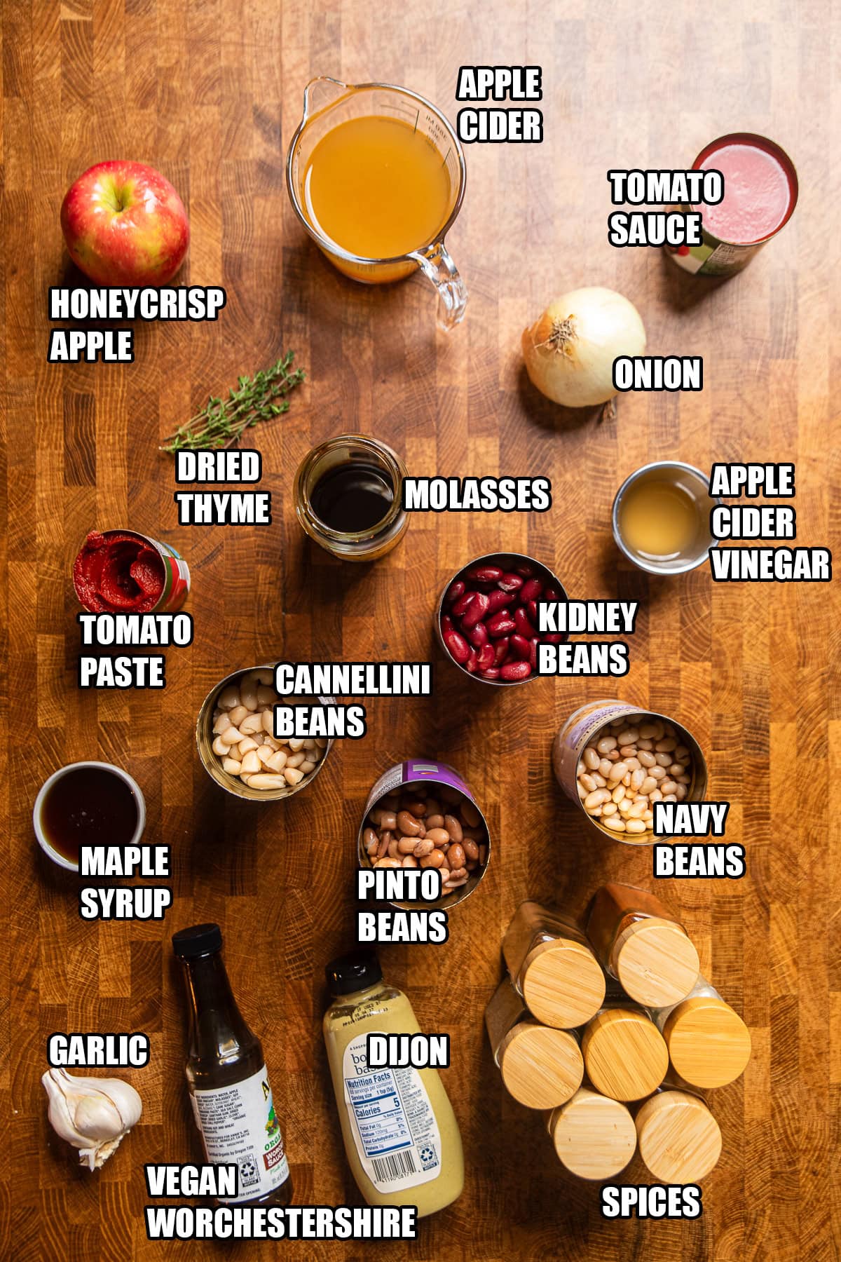 ingredients on a table to make apple cider slow cooker baked beans.