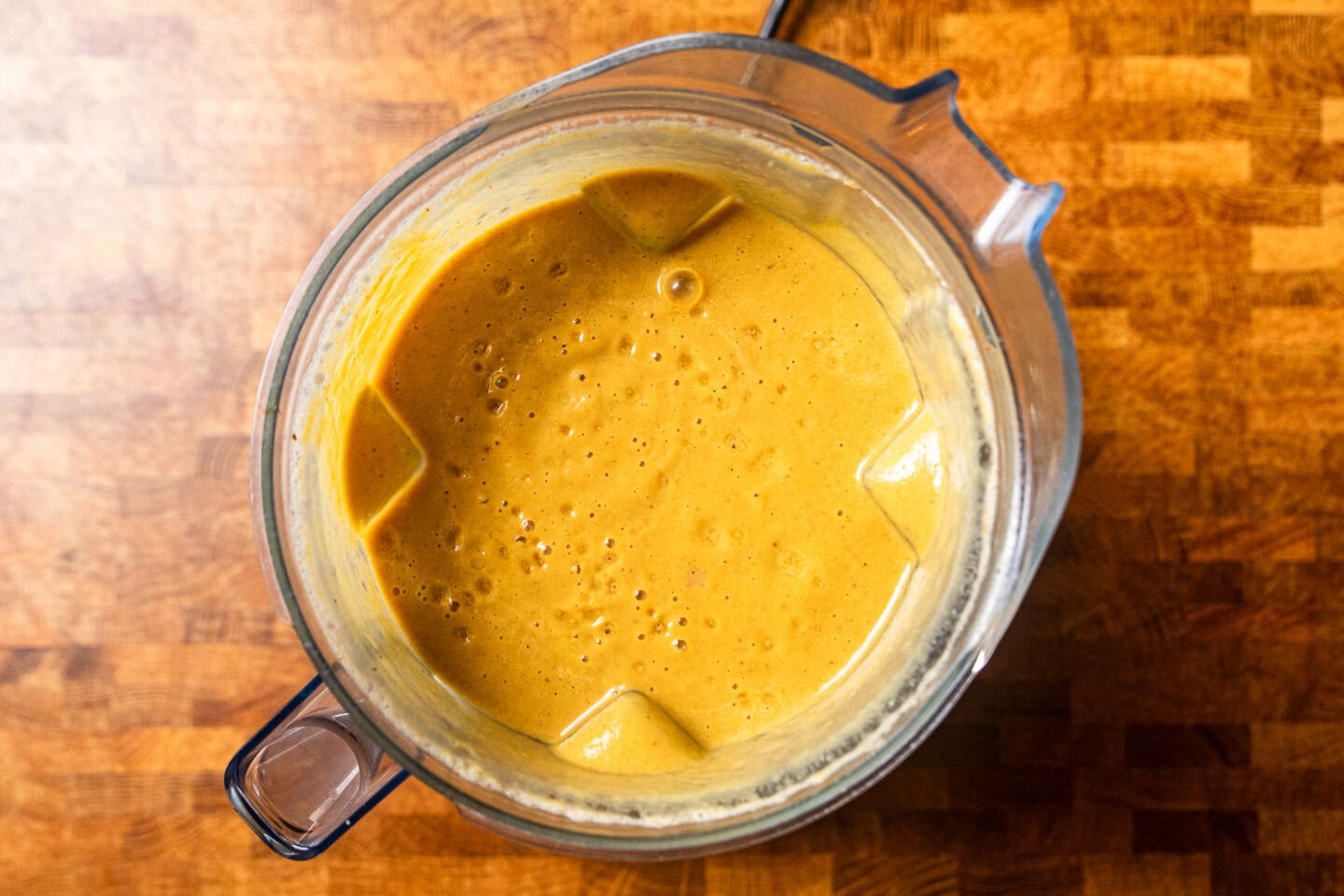 blended butternut squash onion soup in a blender.