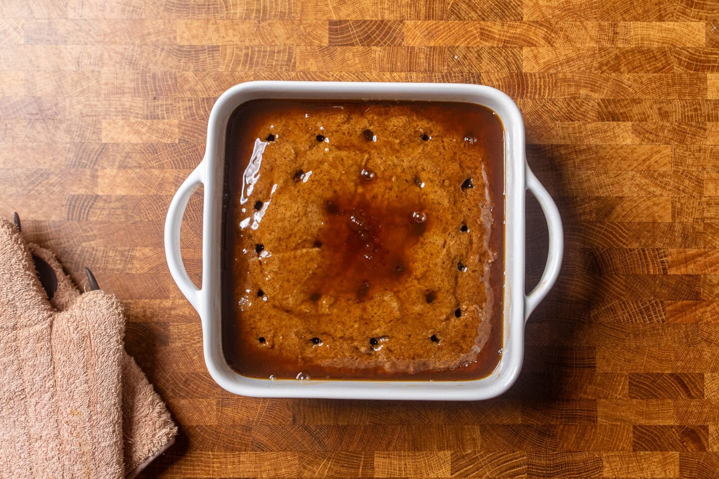 toffee pudding with toffee sauce poured over it.