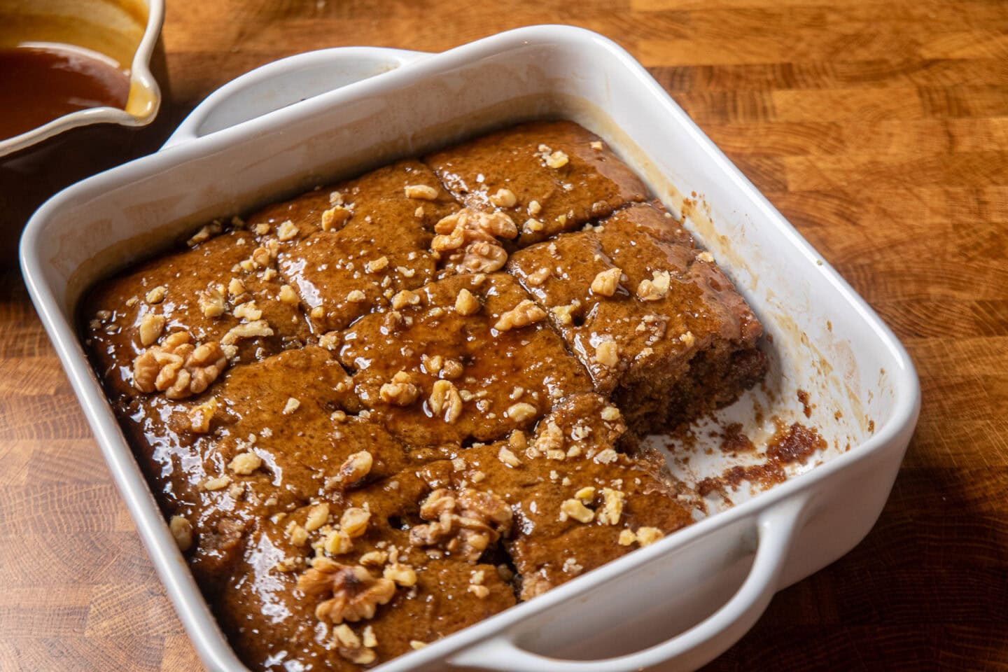 finished toffee pudding topped with chopped walnuts.