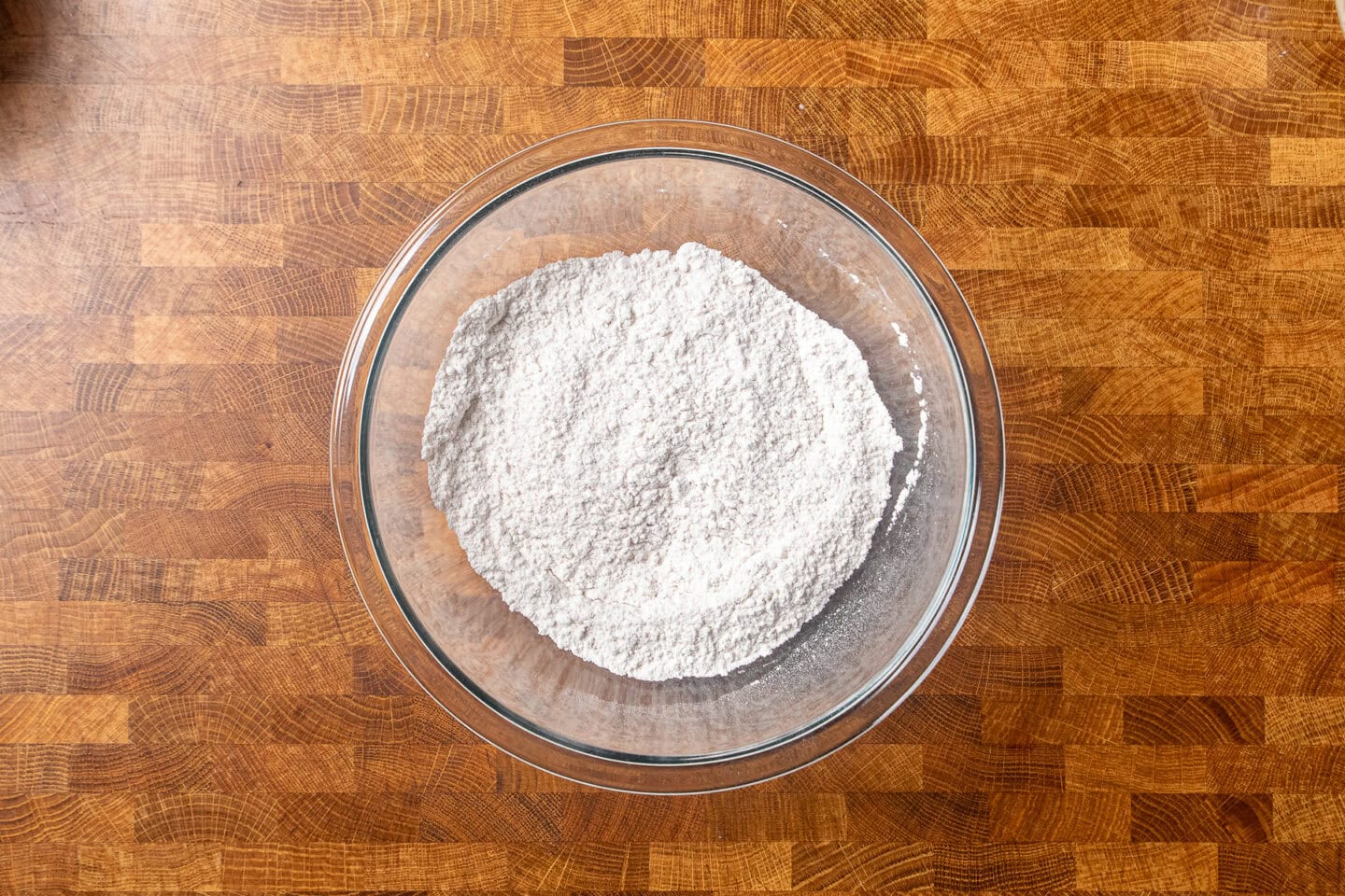 dry ingredients to make toffee pudding in a glass bowl.