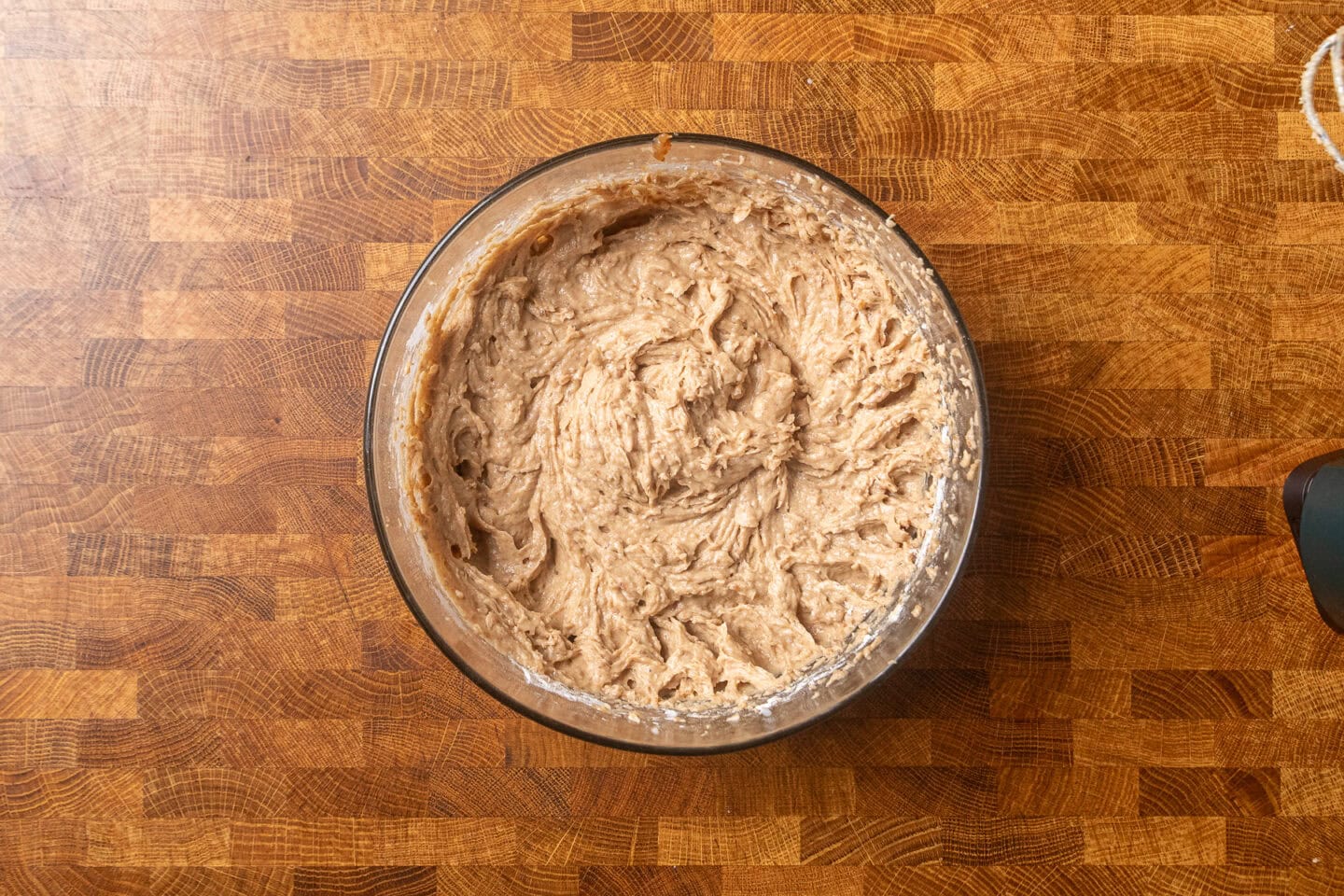 wet mixture for toffee pudding blended together in a bowl.